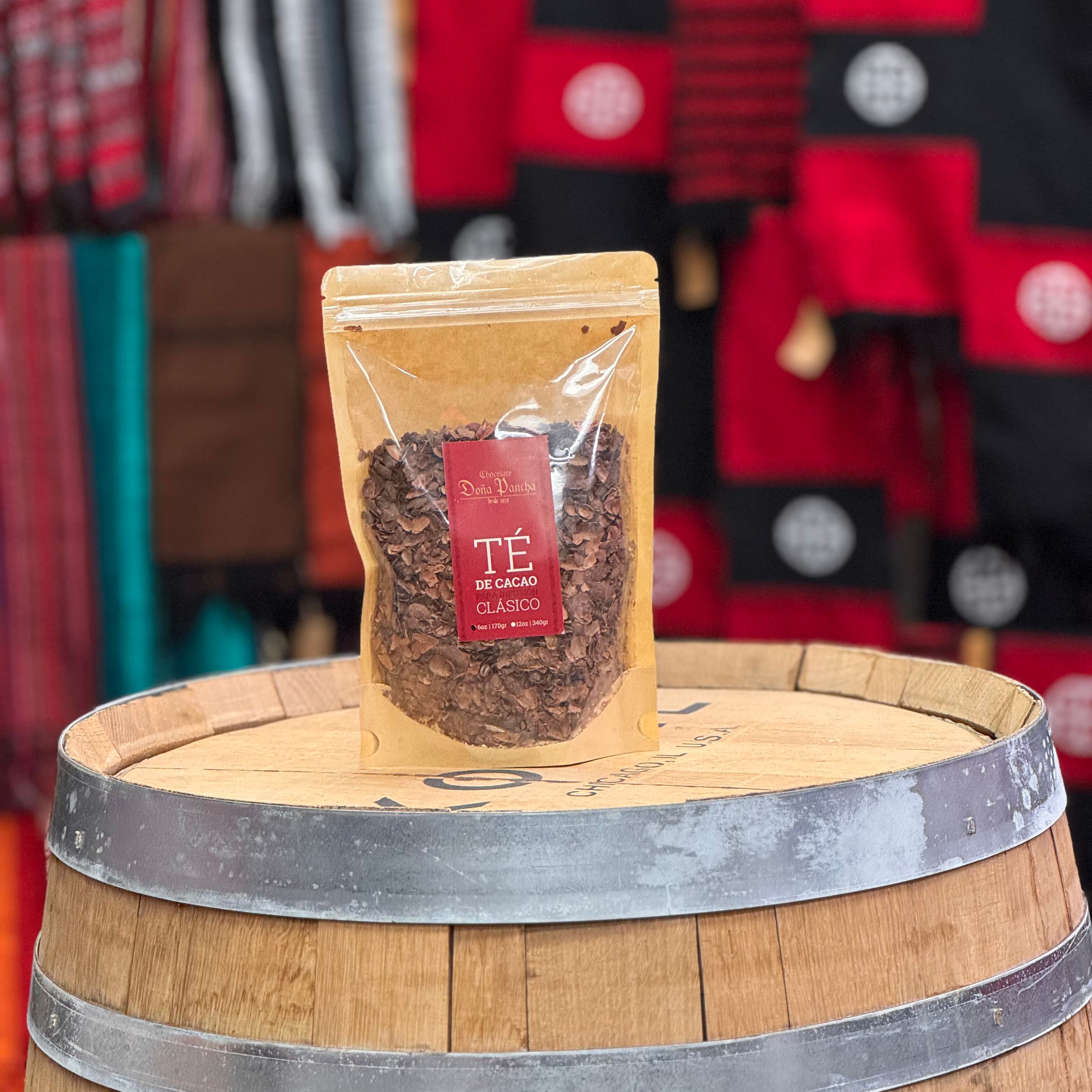 Tea package on a wooden barrel with a colorful background